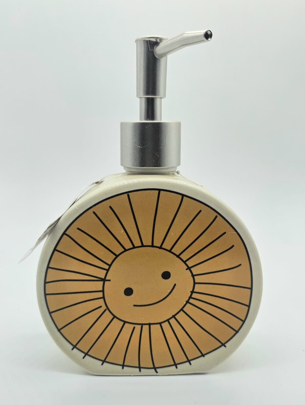 Beekman 1802 “Happy Place” ceramic soap dispenser featuring a smiling sun design